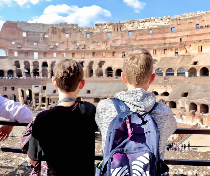 Ed and a  teenaged friend gazing at the Colosseum in Rome
